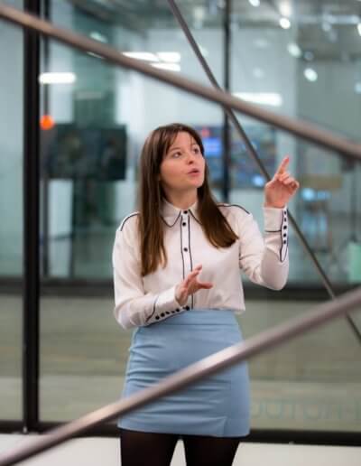 Woman pointing at artwork